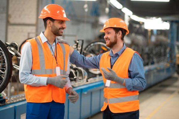 colleagues-safety-equipment-work_23-2148976370